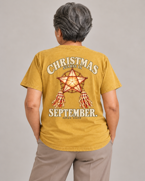 Christmas Starts in September Tee in faded-mustard — model back view