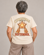Christmas Starts in September Tee in Barong Cream — model back view