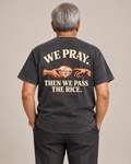 We Pray. Then We Pass the Rice. Tee in Uling Black — model back view